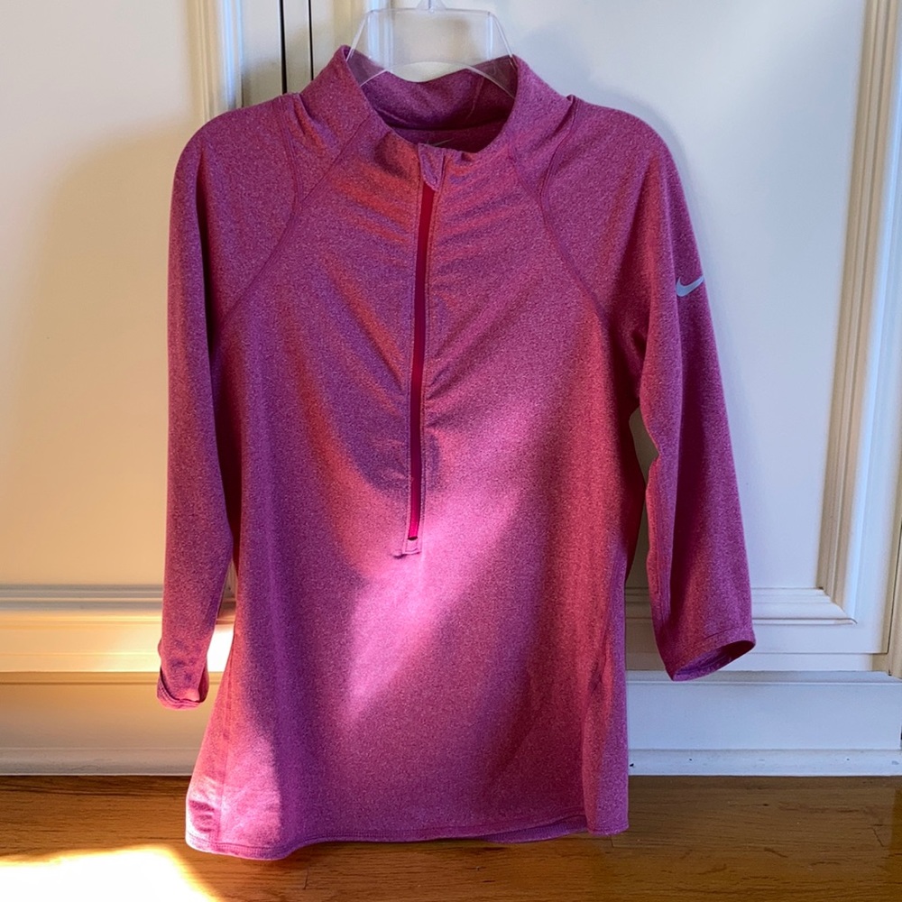 Women’s NIKE half zip top.